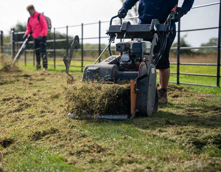 Lawn care service company working on a customers lawn
